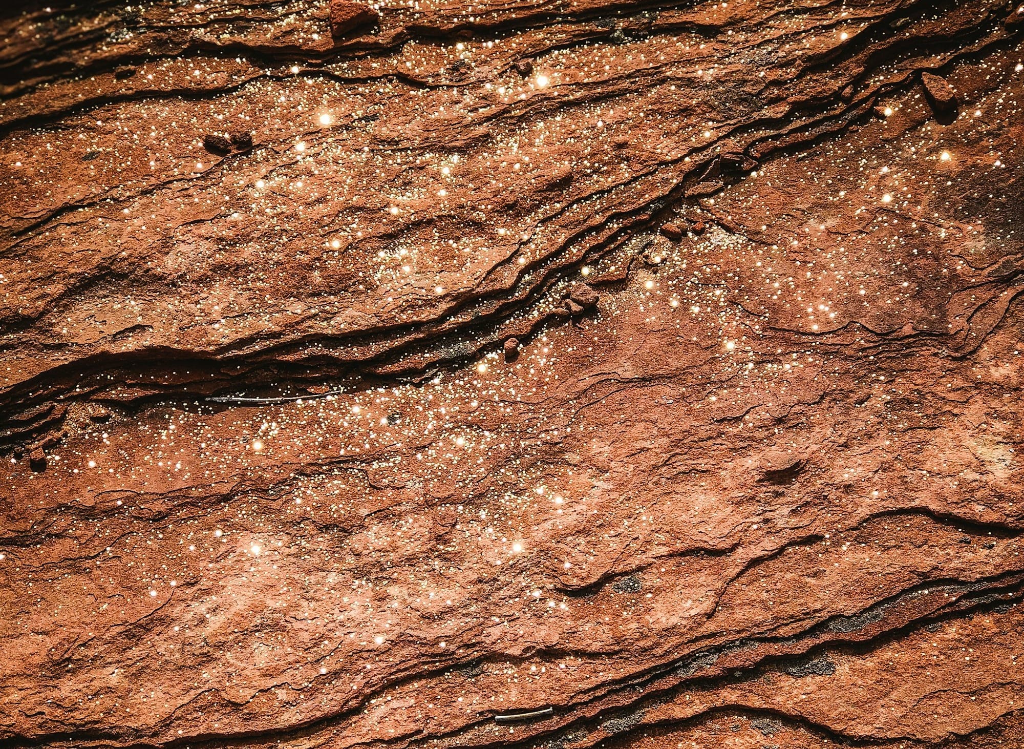 a close up of a rock surface with water